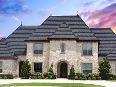 Home with a dark gray stone-coated steel roof