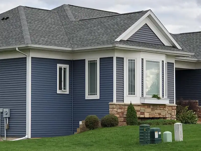 Blue home with new shingles